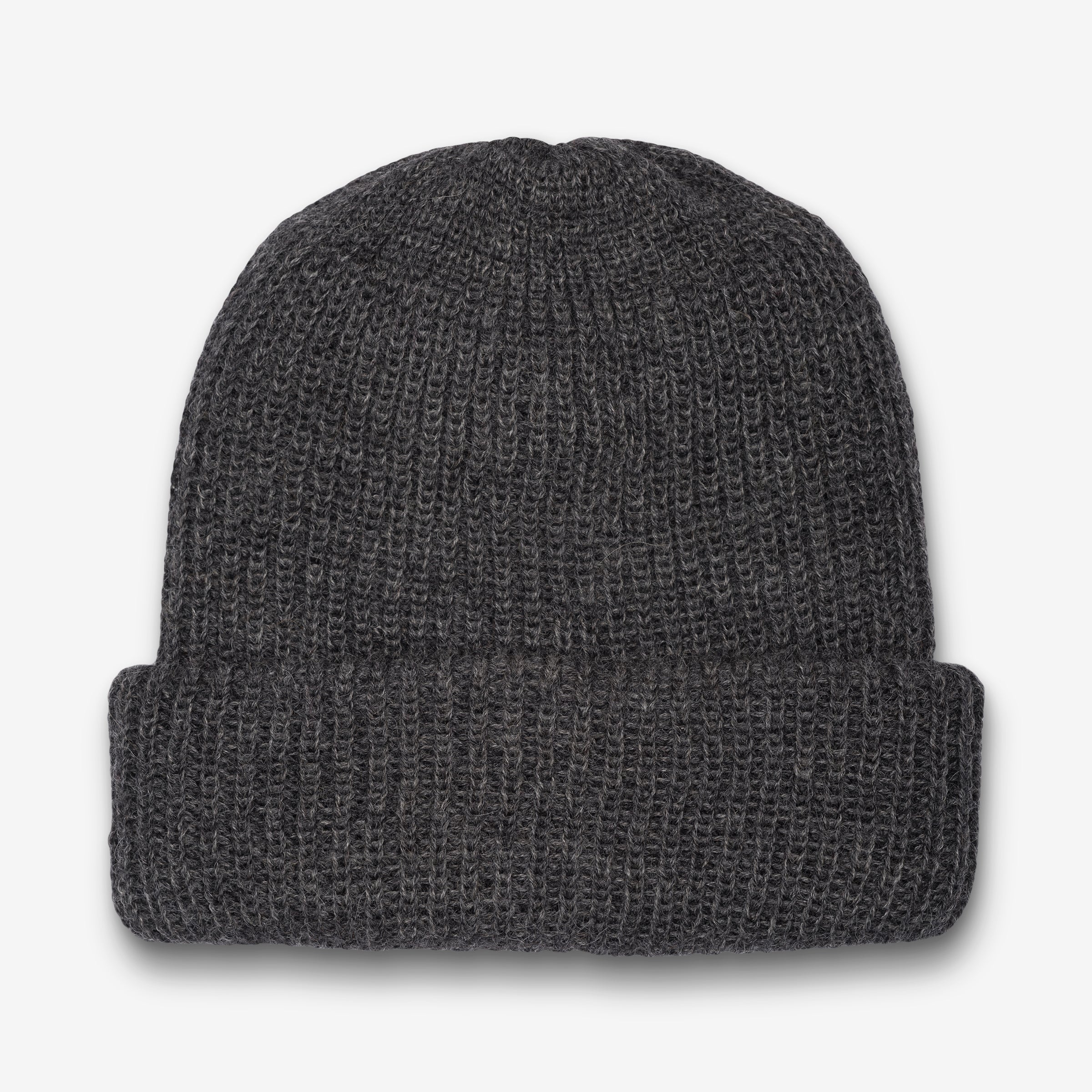 A gray hand-knit baby alpaca wool beanie laid flat on a surface.